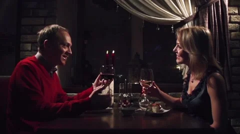Evening date with wine in a restaurant in slow motion Stock Footage 58877796