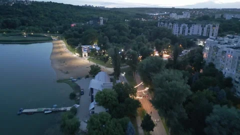 Evening Drone Flight Above Urban Beach and Lakeside District Stock Footage 341765426