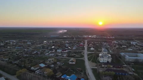 Evening drone flight over the city with a church on the river Volga bank Video stock 198134110