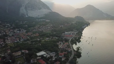 Evening drone shot of sunset above lake Maggiore at high altitude Video stock 127974746