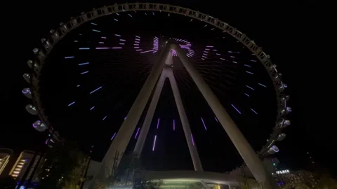 Evening Dubai, the carousel lights up and puts on a show. Emirates carousel Stock Footage 228734168