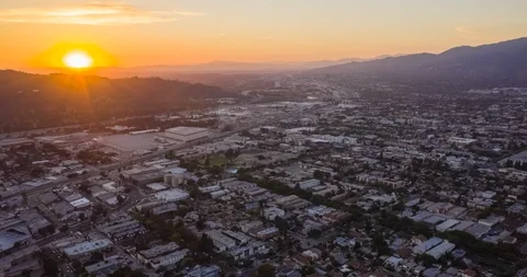 Evening to Dusk Sunset Behind Mountain Aerial Motion Time Lapse Stock Footage 129404987
