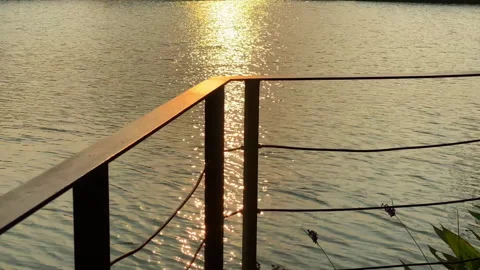 Evening on the edge of the bridge with sea Stock Footage 253396994