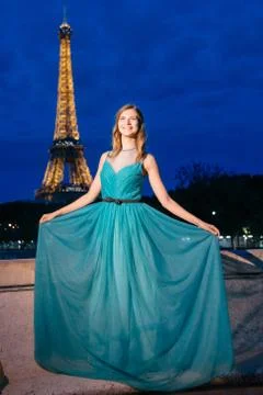 Evening Eiffel tower with lights in the background. Portrait of a gorgeous ro Stock Photos