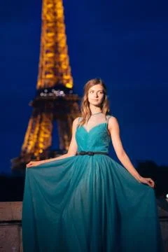 Evening Eiffel tower with lights in the background. Portrait of a gorgeous ro Stock Photos