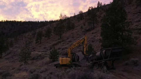 Evening Excavator Dragging Trammel Drone Shot Stock Footage 146553092