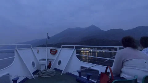 Evening ferry ride with mountain range landscape, Lake Como, Italy, Europe Trip Stock Footage 157995027