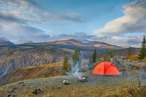 Evening by the fire in the mountains. Stock Photos