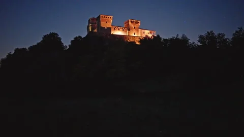 Evening Fireflies in Field Below Castello di Torrechiara Stock Footage 344589943