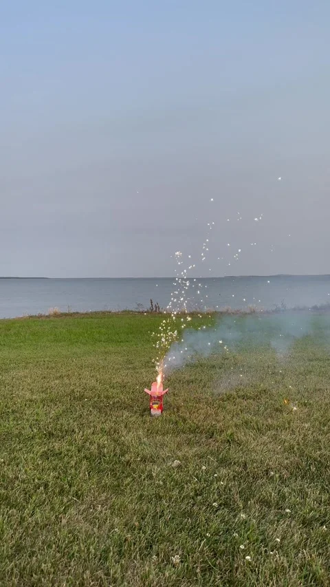 EVENING FIREWORKS BY THE LAKE Stock-Footage 248580688
