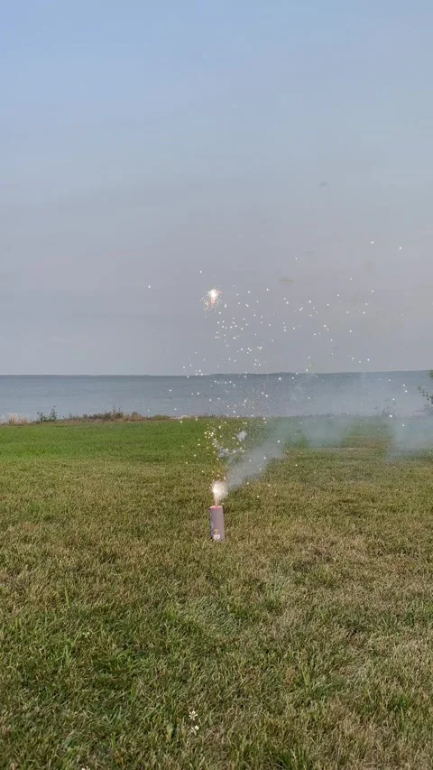 EVENING FIREWORKS BY THE LAKE Stock-Footage 248580695