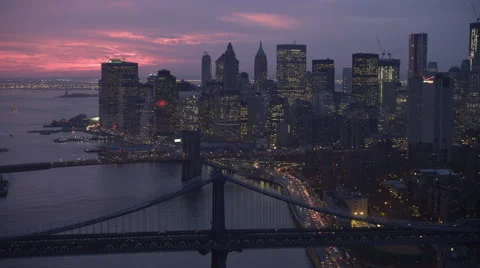 Evening flight above East River and over Manhattan Bridge toward Freedom Tower Stock Footage 59529712