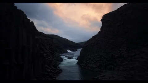 Evening flight over the mouth of a wild river in Island Stock Footage 297119161