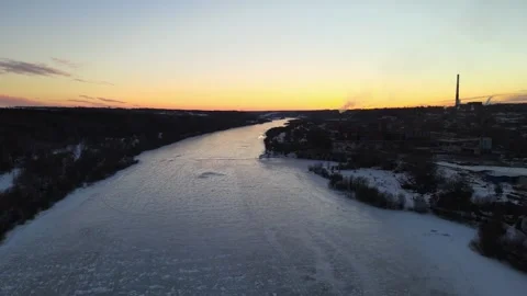 Evening flight over the Oka river, covered with ice in winter, aerial view Stock-Footage 254084833