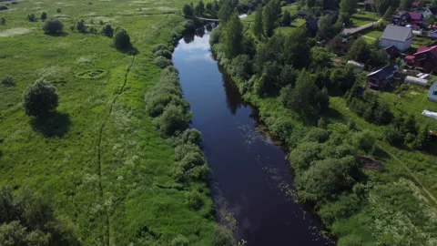 Evening flight over the river among the fields Stock Footage 157697378