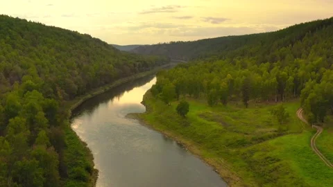 Evening flight over the river with a beautiful sunset. Golden hour. Video stock 139856753