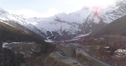 Evening fly over Saas Fee park house - Aerial 4K - Phantom 4 PRO Video stock 75157854