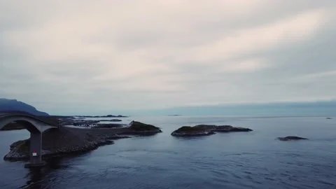 Evening flying over the bridge next to the cars, islands in Norway Stock Footage 224143193