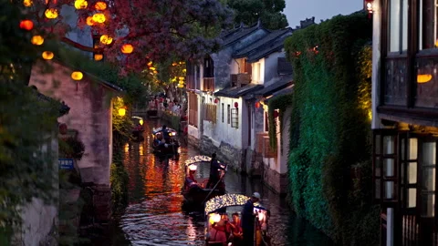 Evening Gondola Ride Through Lantern-Lit Canals in Zhouzhuang Stock Footage 338026226