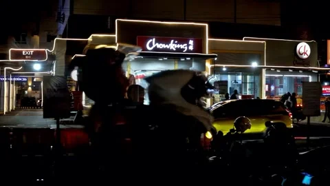Evening ground view of an intersection in a commercial district of Mandaue Stock Footage 347848290