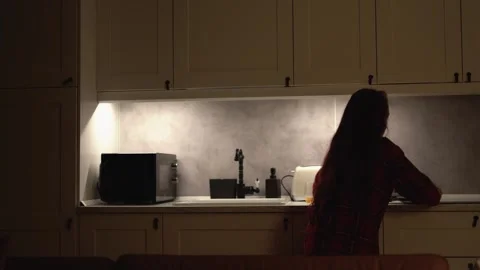 An Evening in the Kitchen I enjoy latenight snacks while reflecting on my Stock Footage 289964783