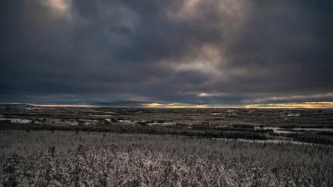 An evening landscape of cloud movement in the sky and snow covered lake in north Video stock 149687021