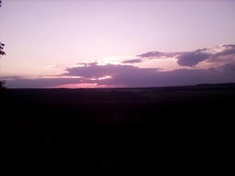 Evening landscape of an endless field Stock Photos