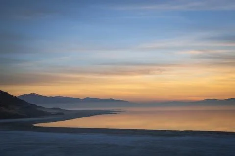 Evening landscape featuring a soft blue and orange sunset gradient sky Foto stock