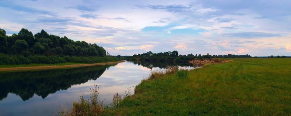 Evening landscape with the river Stock Photos