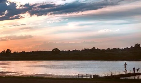 Evening landscape: sunset over a small river Stock Photos