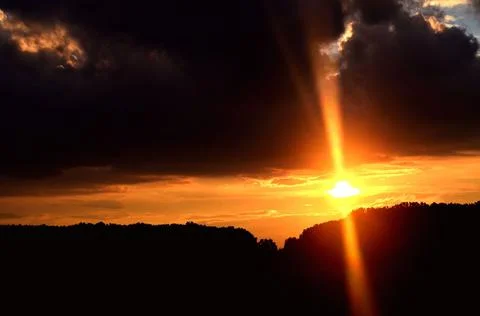 Evening, the last bright ray of the setting sun Stock Photos