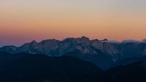 Evening Light and Dusk on an Alpine Montain Range Stock Footage 149909202