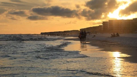 Evening light and sun with the people walking on the beach in Florida Stock Footage 86367209