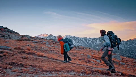 Evening light casts a warm glow over the Pyrenees mountains in Spain Stock Footage 303629772