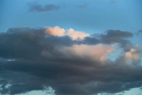 Evening light on the clouds in the sky, clouds in the evening sunset Stock Photos