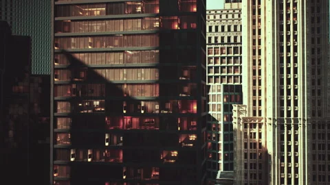 Evening light highlights modern apartment buildings in a bustling city Stock Footage 304468626