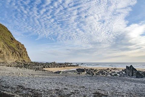 Evening light looking over Duckpool bay beach 스톡 사진