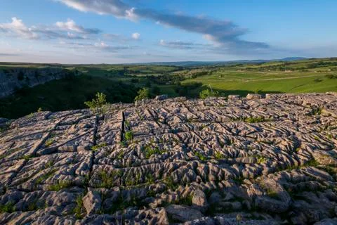 Evening light shows dramatic surface of the famous Limestone Pavement at Malham Stock Photos