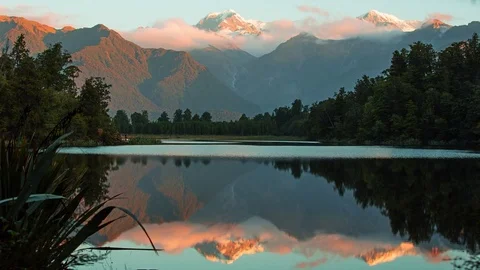 Evening Light on Southern Alps reflected in lake Matheson 動画素材 73877521
