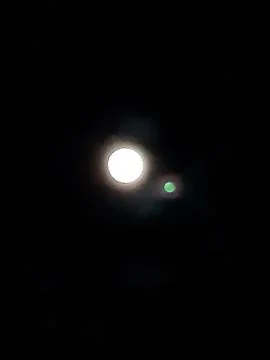 In the evening the moonlight shone in the eastern sky and the sky was clear. Stock Photos