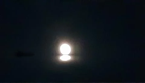 In the evening the moonlight shone in the eastern sky and the sky was clear. Stock Photos