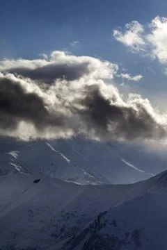 Evening mountain and sunlight clouds Stock Photos