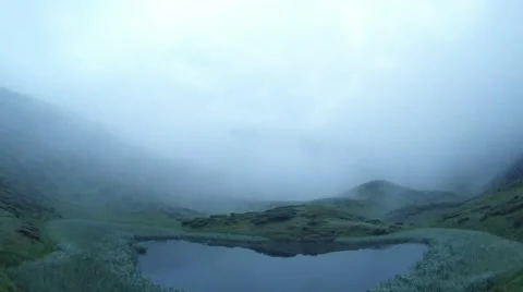 Evening on the mountain lake, mist somewhere in a hurry Stock Footage 40619675