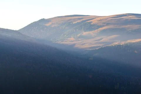 Evening in the mountains with the last rays of the sun Stock Photos