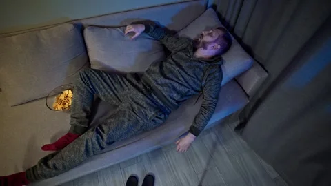 Evening nap on the couch after a long day. Stock Footage 323462591