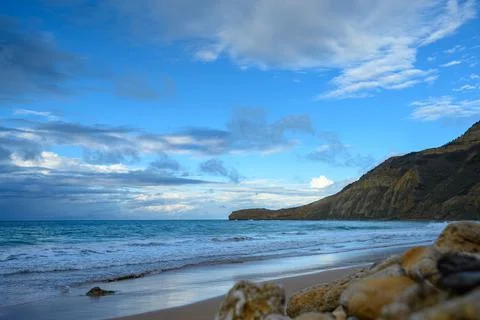 Evening ocean view, mountains in background, beach before sunset, Monte Crist Stock Photos