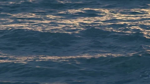 Evening Ocean Waves Texture with Golden Reflections Stock-Footage 340180044