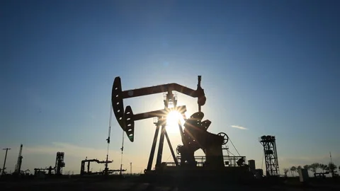 In the evening, the oil pump is running. Timelapse Stock Footage