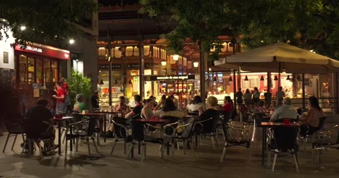 Evening outdoor dining at Mercado de San Miguel in Madrid 動画素材 338338330