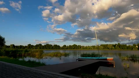 Evening over the lake in summer, time-lapse video, clouds run across the sky Stock Footage 181135896